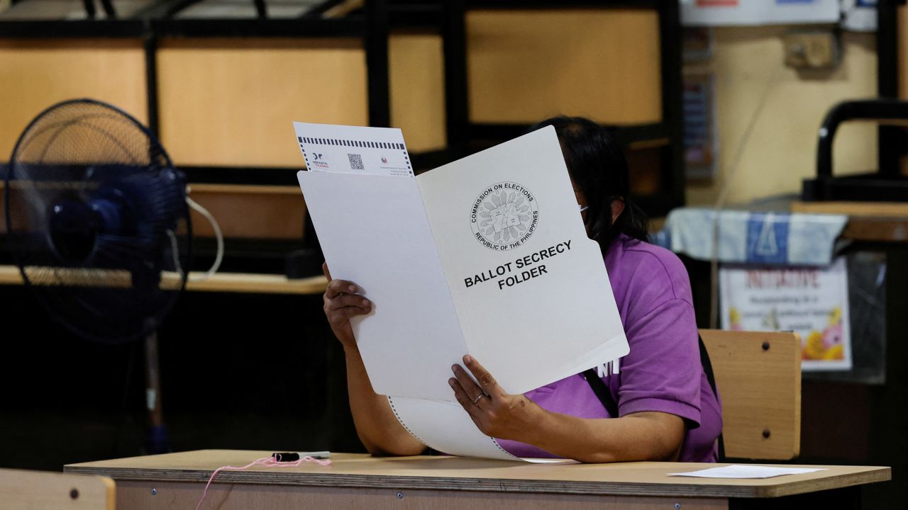 A voter casts her ballot in Manila, Philippines, on May 9.