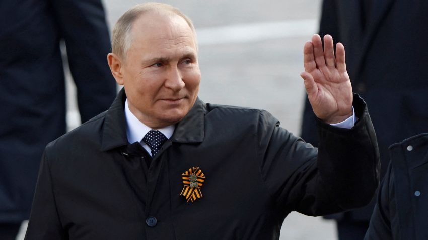 Russian President Vladimir Putin waves to spectators after a military parade on Victory Day, which marks the 77th anniversary of the victory over Nazi Germany in World War Two, in Red Square in central Moscow, Russia May 9, 2022. REUTERS/Maxim Shemetov