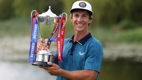 Thorbjørn Olesen poses with the trophy after winning the British Masters.