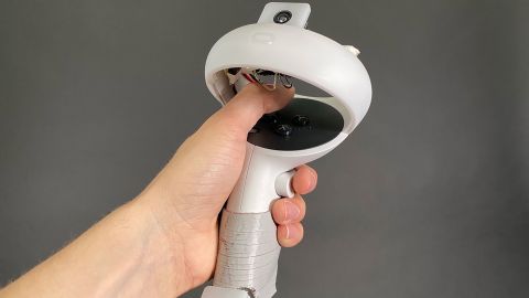 Researchers affixed two fisheye-lens cameras to Quest 2 controllers to enable full-body tracking in VR.