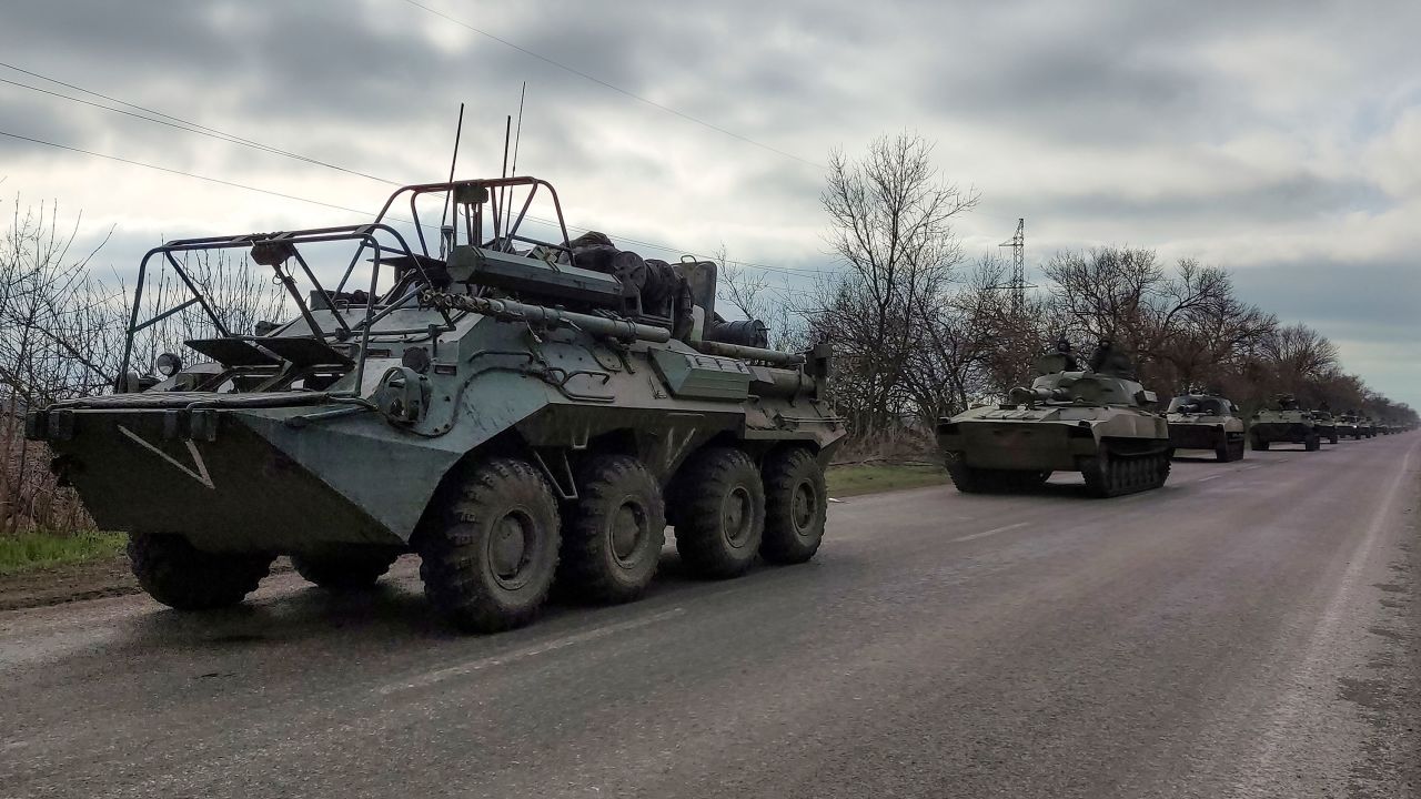 A Russian military convoy moves on a highway in an area controlled by Russian-backed separatist forces near Mariupol, Ukraine, on April 16, 2022. 
