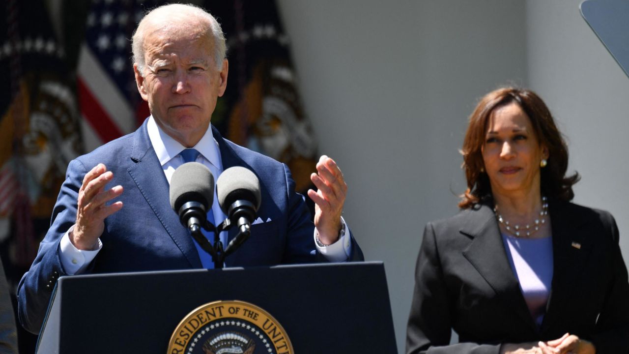 US Vice President Kamala Harris (R) listens as US President Joe Biden delivers remarks on lowering the cost of high speed internet, in the Rose Garden of the White House in Washington, DC, on May 9, 2022. (Photo by Nicholas Kamm / AFP) (Photo by NICHOLAS KAMM/AFP via Getty Images)