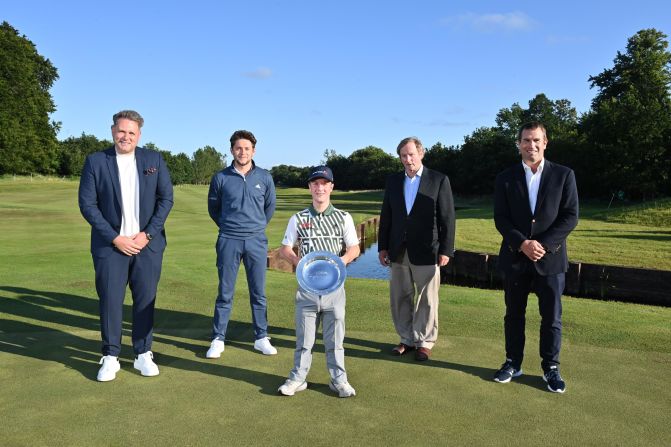 At Galgorm, Northern Ireland, in August 2021, Lawlor poses with the EDGA World Disability Invitational trophy, a win that moved Horan (center left) to tears. An advocate for disability golf, the former One Direction star is now a close friend of Lawlor's. 