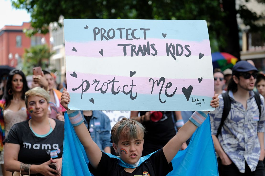 A young child takes part in the Trans Pride March celebrating gender identity in Portland, Oregon, on June 16, 2018.