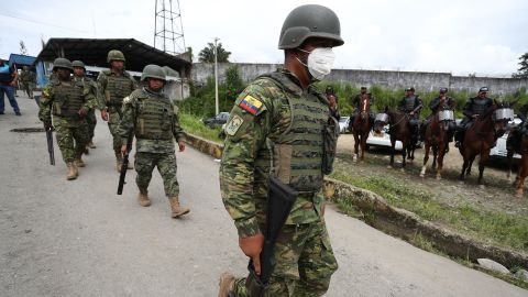 Soldiers guard Ecuador's Social Bellavista prison on Monday after at least 43 people died in a riot. 