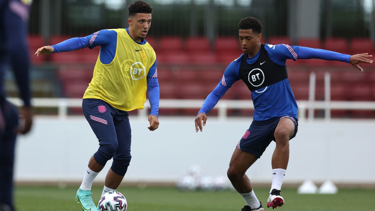 Jadon Sancho (left) and Jude Bellingham (right) of England in action during the England Training Session at St George's Park on June 14, 2021 in Burton upon Trent, England. 