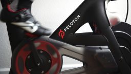SAN ANSELMO, CALIFORNIA - APRIL 06: Cari Gundee rides her Peloton exercise bike at her home on April 06, 2020 in San Anselmo, California.  More people are turning to Peloton due to shelter-in-place orders because of the coronavirus (COVID-19). Peloton stock has continued to rise over recent weeks even as most of the stock market has plummeted. However, Peloton announced today that they will temporarily pause all live classes until the end of April because an employee tested positive for COVID-19.  (Photo by Ezra Shaw/Getty Images)