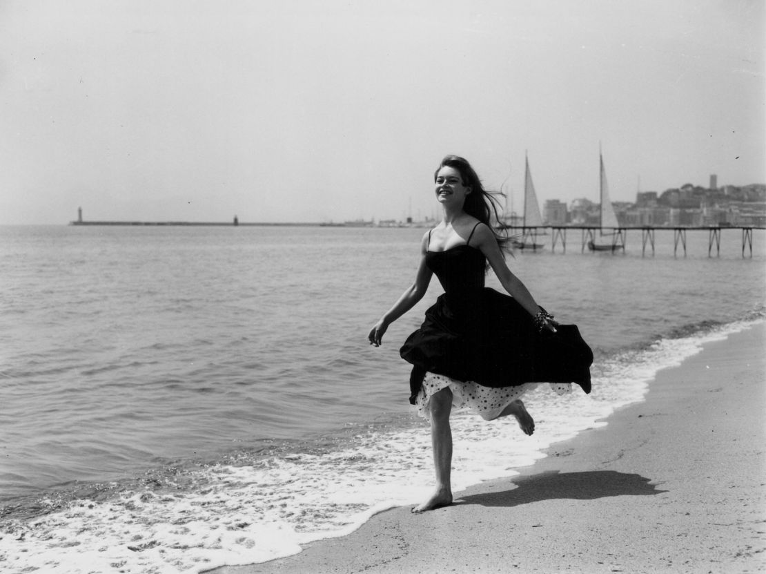 Film star Brigitte Bardot eschews footwear altogether and runs barefoot on a beach in Cannes during the 1956 festival, where "The Silent World" by Jacques-Yves Cousteau and Louis Malle won the Palme d'Or. 