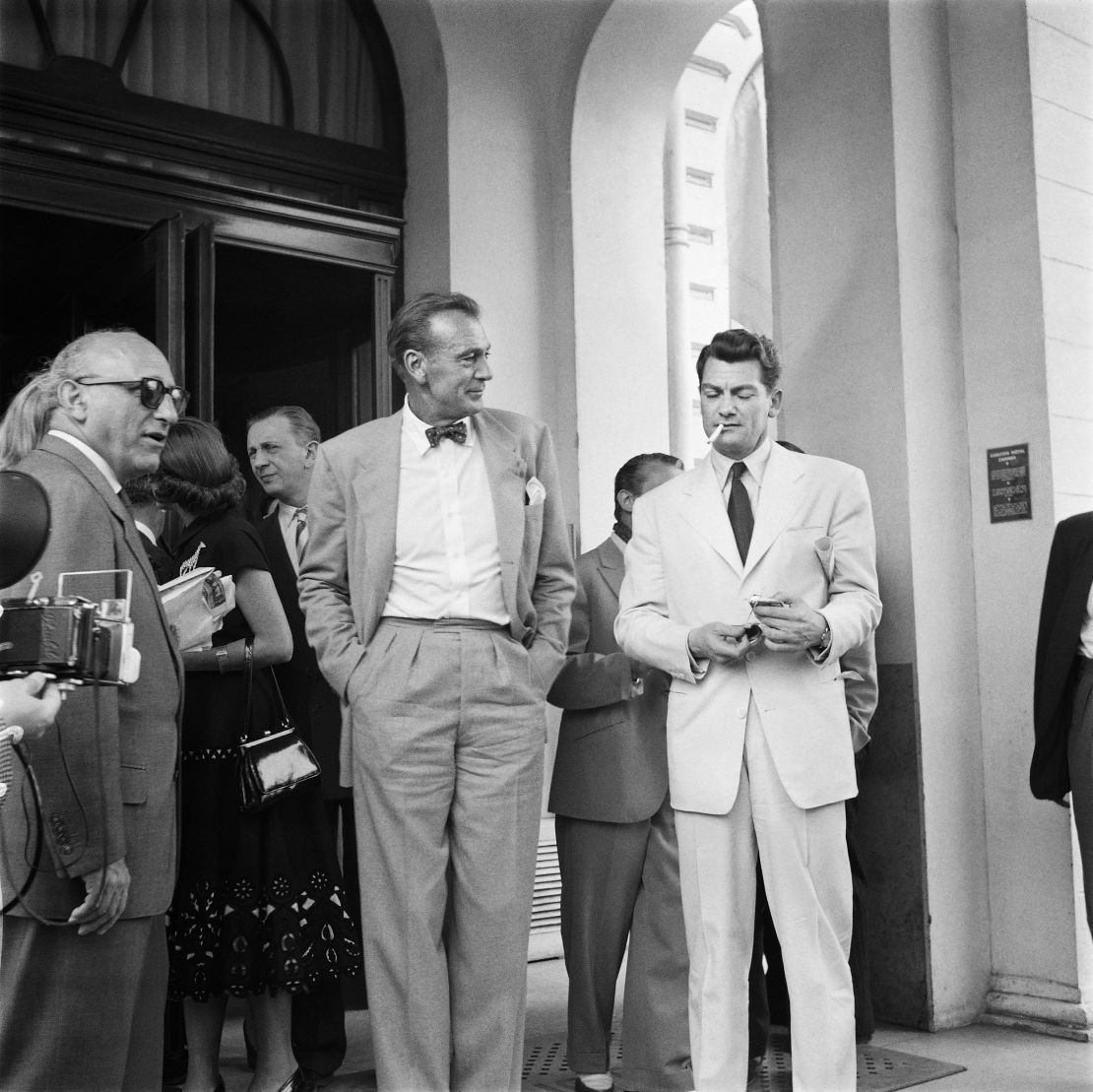 Cigarettes and bow ties were the height of fashion in the 50s. American actor Gary Cooper (left) talks to French actor Jean Marais (right) during the Cannes Film Festival in 1953.