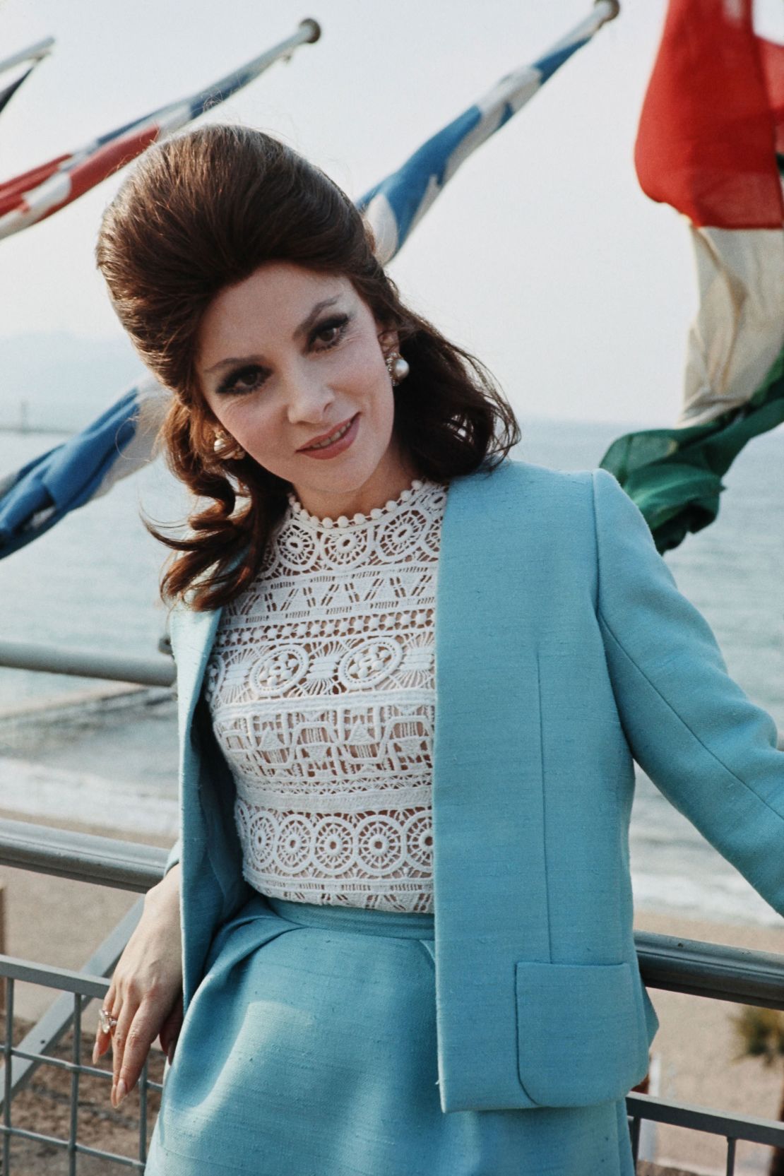 Italian actress Gina Lollobrigida contrasts a demure powder blue suit with racy lace on top at Cannes in 1972. 