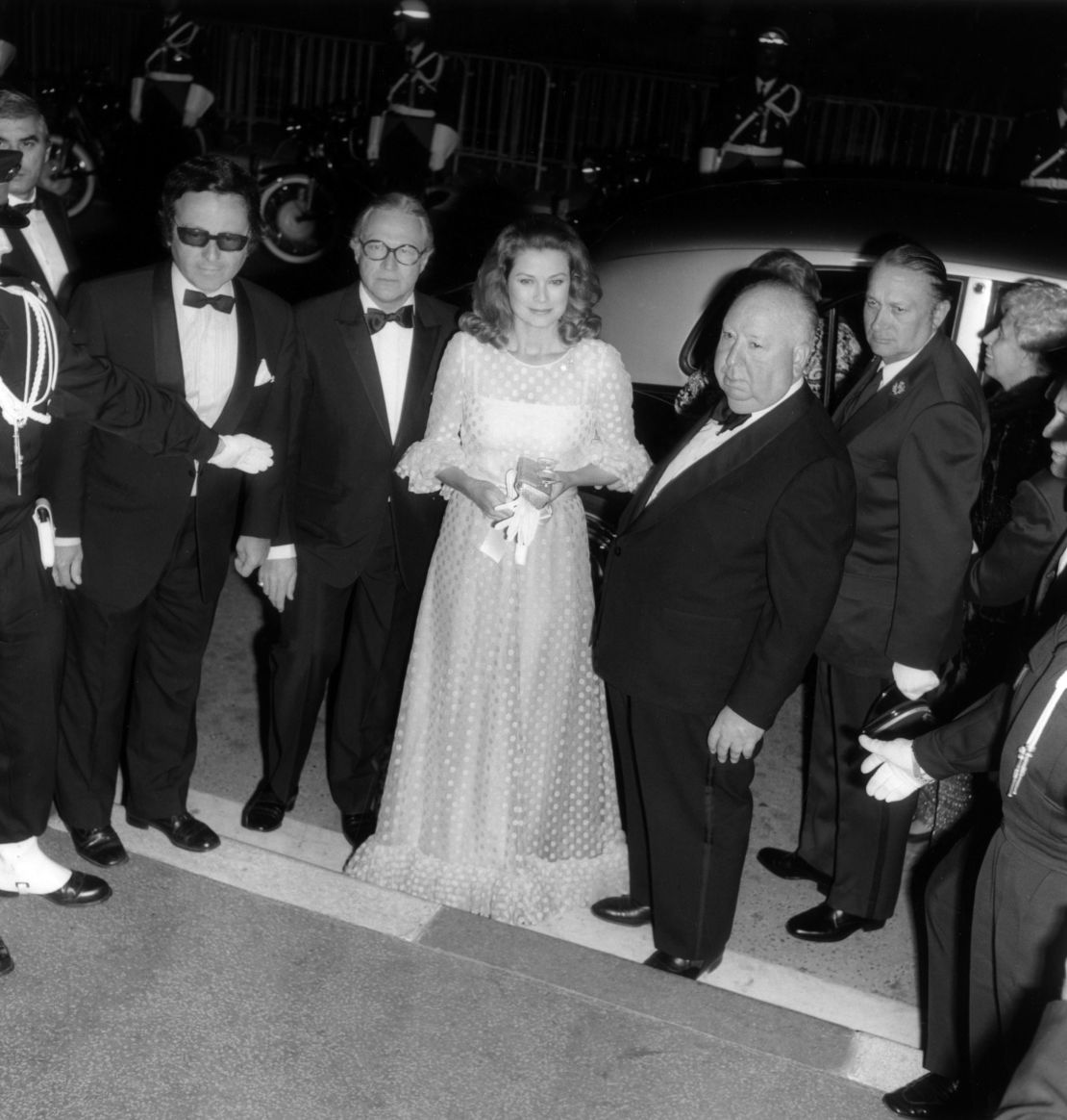 Grace Kelly poses with director Alfred Hitchcock during the 1972 Cannes Film Festival. 