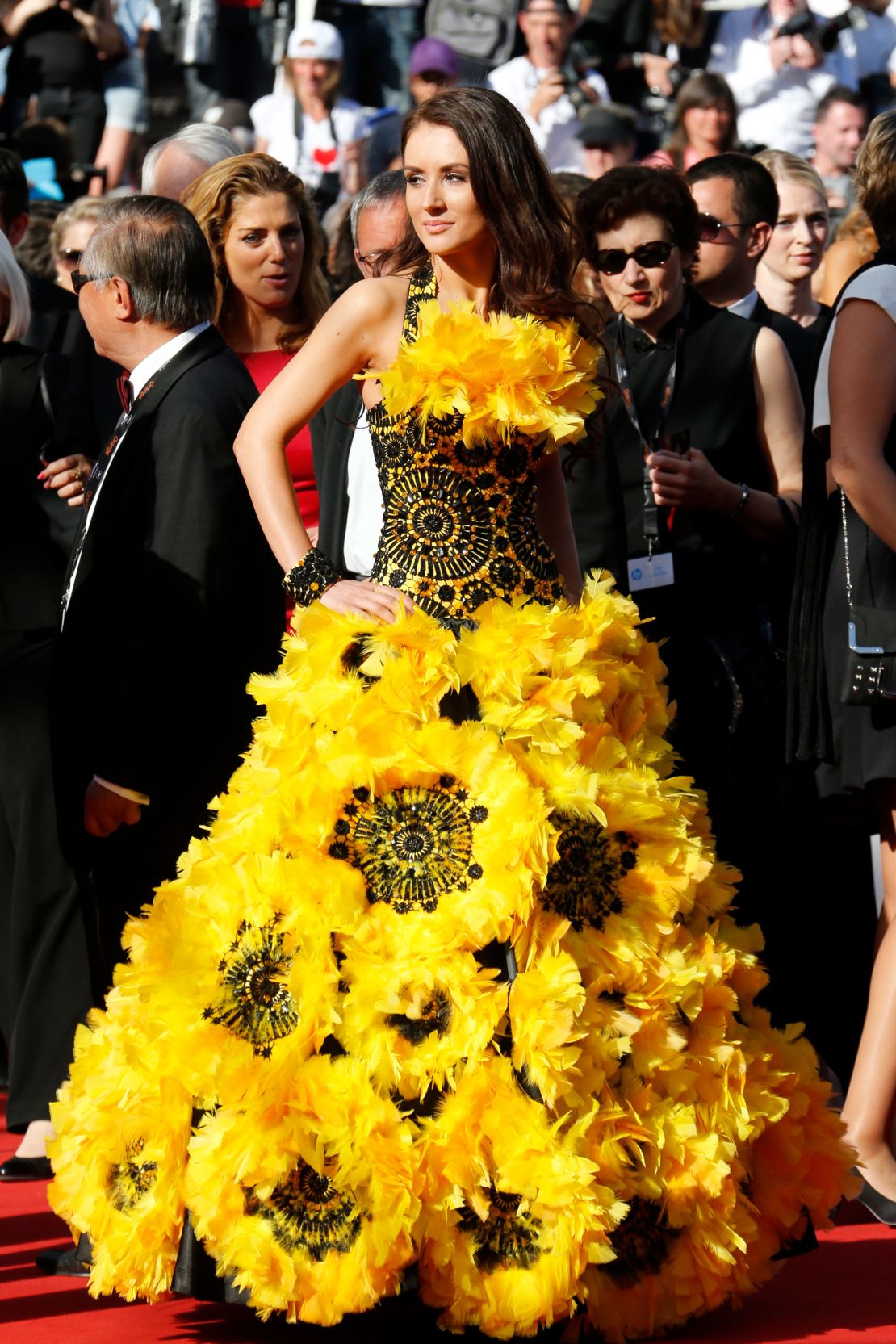 In 2013 two guests put the celebrities to shame with their striking outfits. The first was this sunflower inspired gown worn at the "Zulu" premiere and closing ceremony during the 66th Annual Cannes Film Festival 2013.