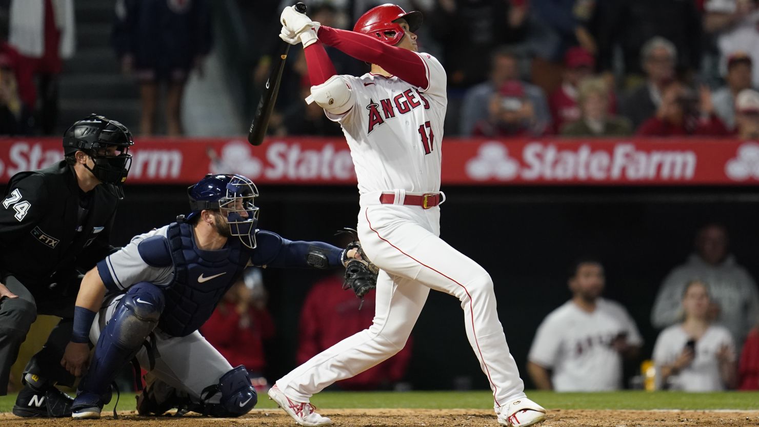 Ohtani (17) hits a grand slam home run during the seventh inning 