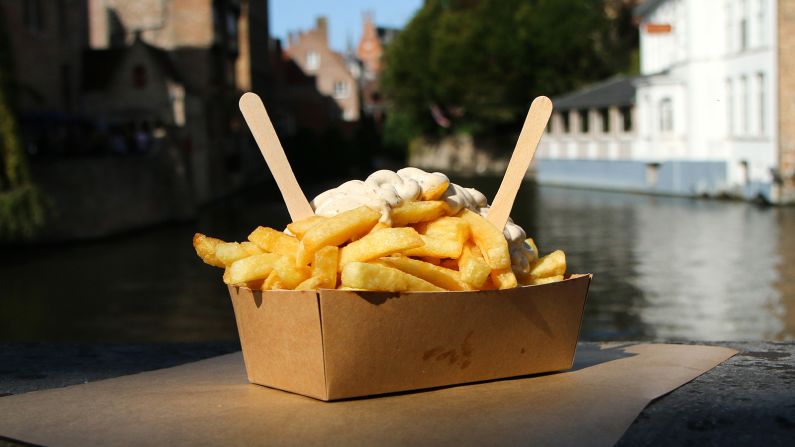 <strong>French fries (Belgium and France):</strong> They're named for the cut of the potato, not the nation. The fries in this particular photo are a traditional street food snack in Bruges, Belgium, and go with pepper sauce.