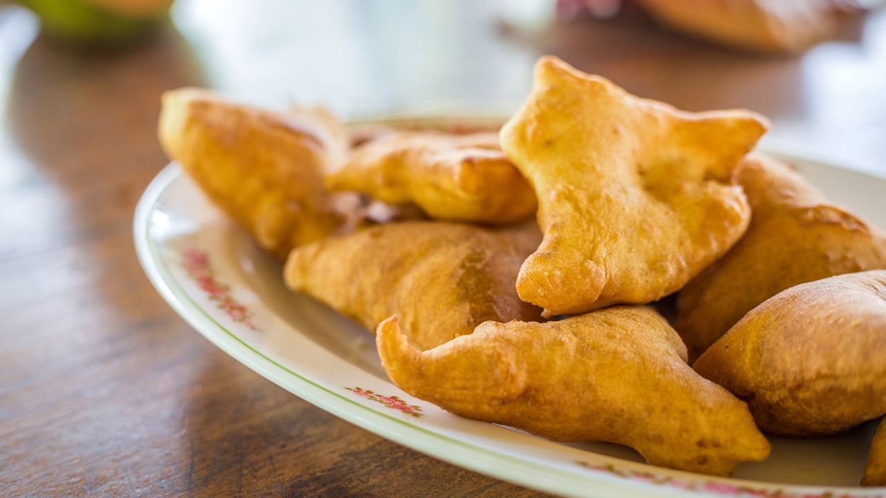<strong>Mandazi (East Africa):</strong> These fluffy, triangular pillows go by many names along the Swahili coast of East Africa and are like mildly sweet doughnuts.