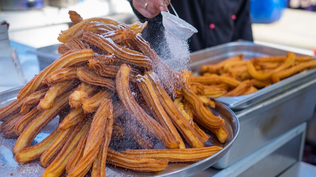 <strong>Churros (Spain, Portugal and Latin America):</strong> Delicious churros sticks are deep fried and dusted with powdered sugar. You can dip them into melted chocolate. 