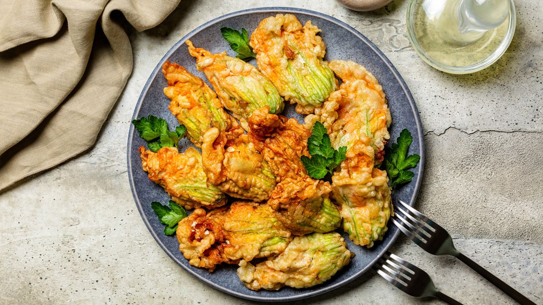 <strong>Zucchini flowers (Italy):</strong> Fried in a batter, these zucchini flowers are stuffed with ricotta cheese and parsley.  