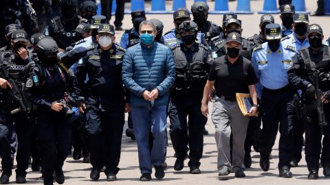 Hernández is escorted by members of the police special forces in Tegucigalpa ahead of his extradition.