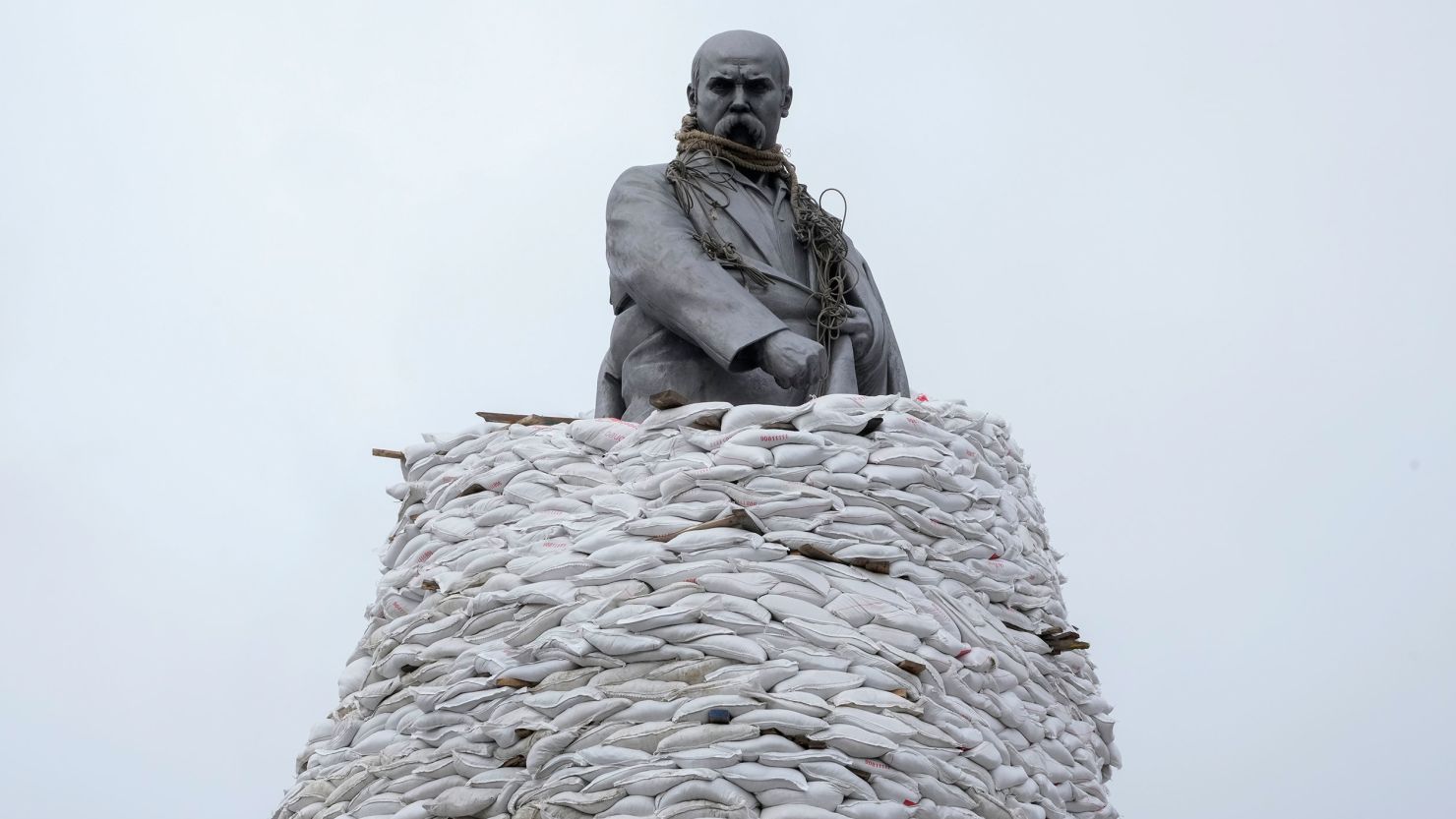 A statue of Ukrainian poet, Taras Shevchenko, is covered with bags to protect it from shelling in Kharkiv, pictured in March.