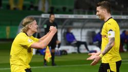 Dortmund's Norwegian forward Erling Braut Haaland (L) celebrates with Dortmund's German forward Marco Reus scoring during the German Cup (DFB Pokal) final football match RB Leipzig v BVB Borussia Dortmund, in Berlin on May 13, 2021. - RESTRICTIONS: ACCORDING TO DFB RULES IMAGE SEQUENCES TO SIMULATE VIDEO IS NOT ALLOWED DURING MATCH TIME. MOBILE (MMS) USE IS NOT ALLOWED DURING AND FOR FURTHER TWO HOURS AFTER THE MATCH. == RESTRICTED TO EDITORIAL USE == FOR MORE INFORMATION CONTACT DFB DIRECTLY AT +49 69 67880 (Photo by ANNEGRET HILSE / POOL / AFP) / RESTRICTIONS: ACCORDING TO DFB RULES IMAGE SEQUENCES TO SIMULATE VIDEO IS NOT ALLOWED DURING MATCH TIME. MOBILE (MMS) USE IS NOT ALLOWED DURING AND FOR FURTHER TWO HOURS AFTER THE MATCH. == RESTRICTED TO EDITORIAL USE == FOR MORE INFORMATION CONTACT DFB DIRECTLY AT +49 69 67880 / RESTRICTIONS: ACCORDING TO DFB RULES IMAGE SEQUENCES TO SIMULATE VIDEO IS NOT ALLOWED DURING MATCH TIME. MOBILE (MMS) USE IS NOT ALLOWED DURING AND FOR FURTHER TWO HOURS AFTER THE MATCH. == RESTRICTED TO EDITORIAL USE == FOR MORE INFORMATION CONTACT DFB DIRECTLY AT +49 69 67880 (Photo by ANNEGRET HILSE/POOL/AFP via Getty Images)