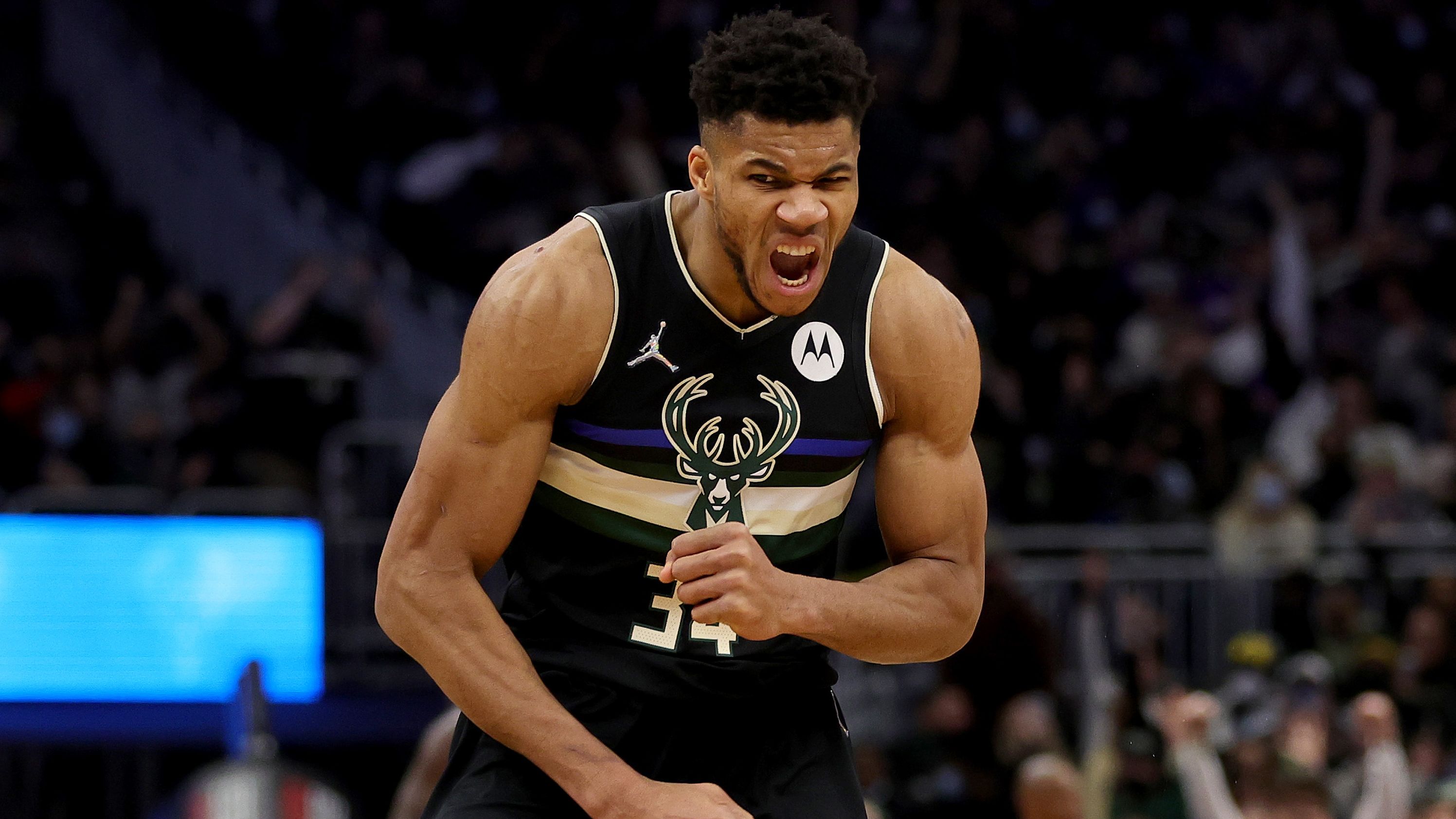 Antetokounmpo reacts to a three-point shot against the New York Knicks. 