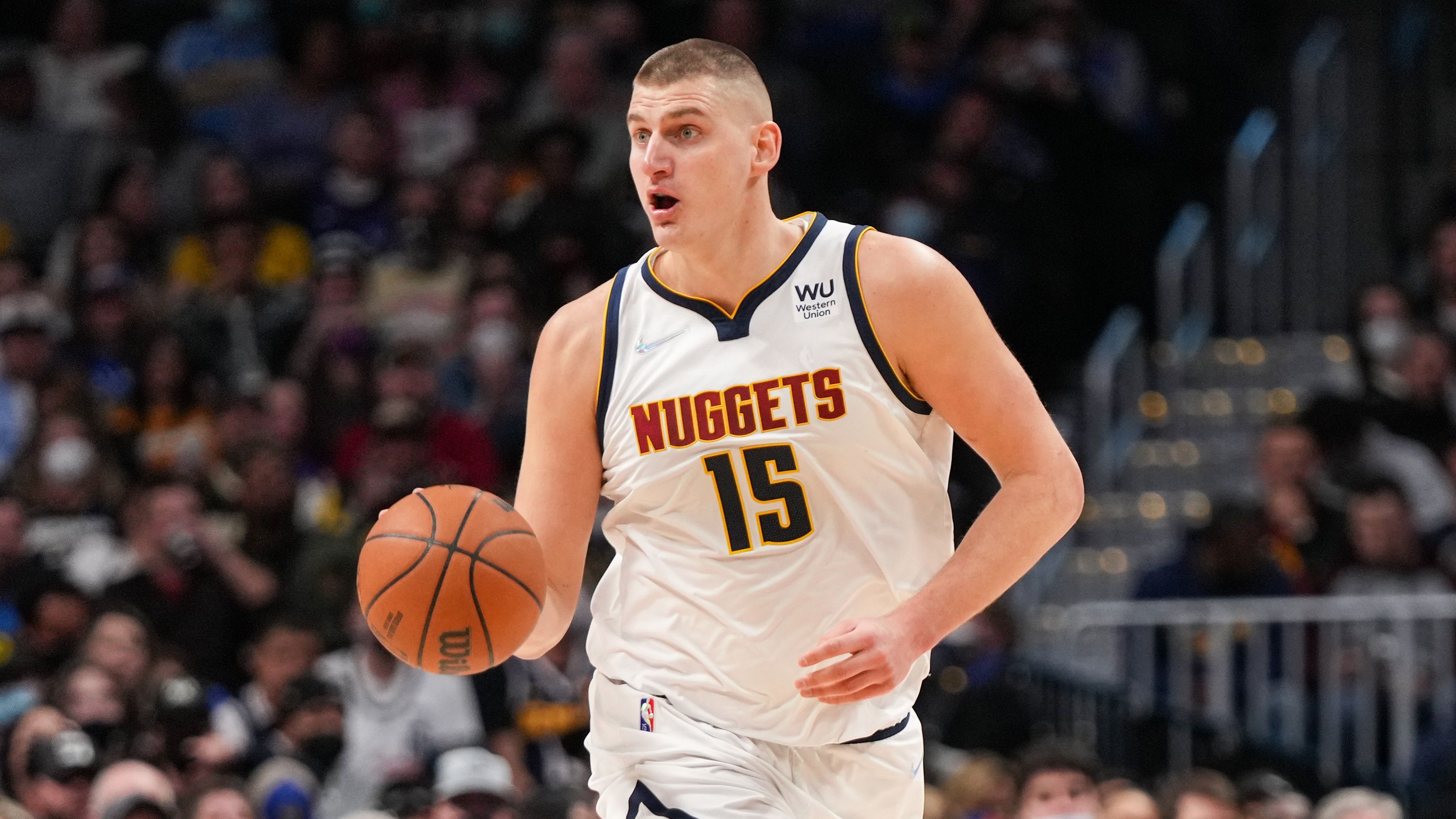 Jokic dribbles against the Memphis Grizzlies at Ball Arena on January 21, 2022.