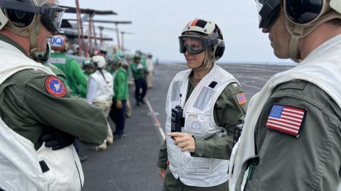 Capt. Amy Bauernshmidt on the flight deck of the USS Abraham Lincoln during flight operations in the Philippine Sea