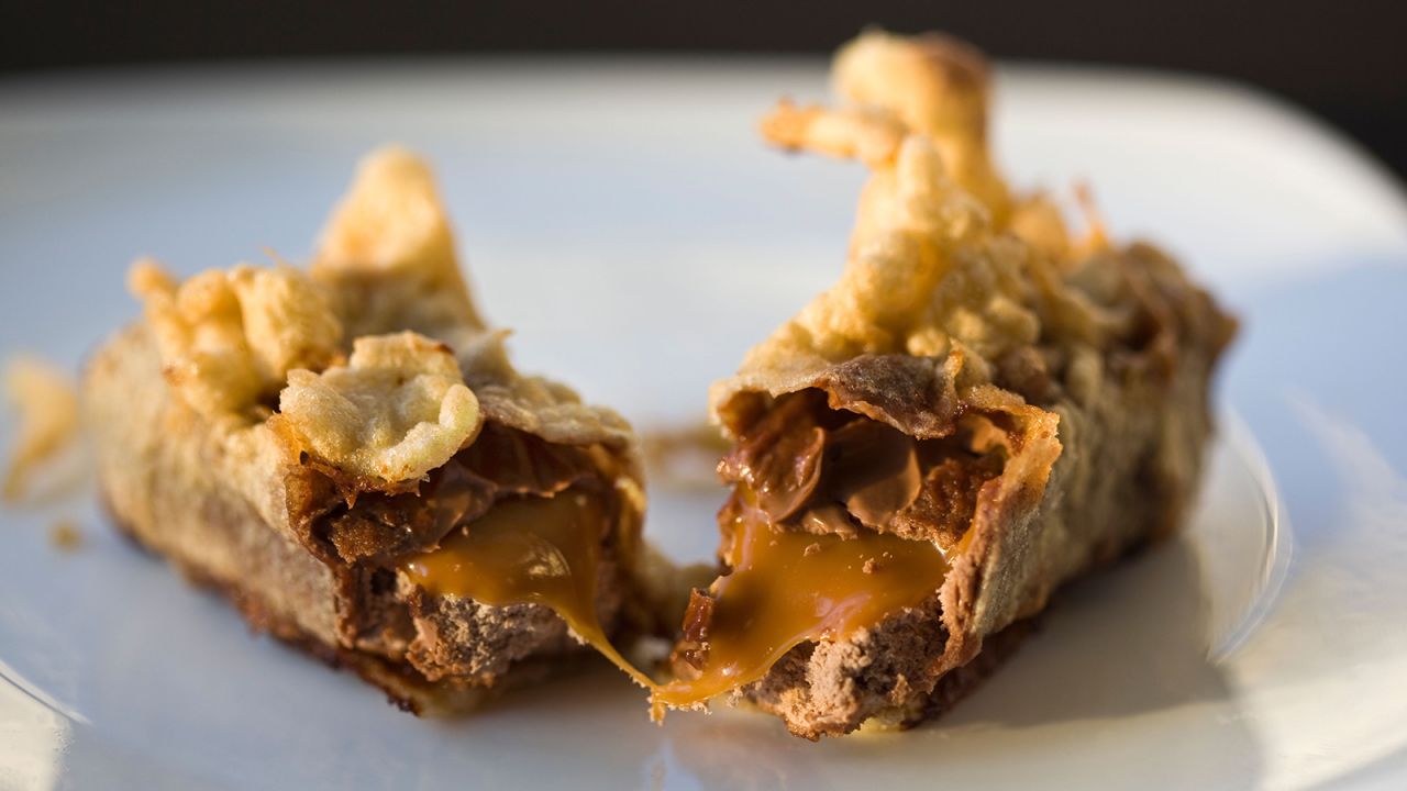 <strong>Deep-fried Mars bar (United Kingdom):</strong> A frozen Mars bar (a chocolate, nougat and caramel candy bar) is dipped in thick batter and fried just until the chocolate is gooey and slightly melted.