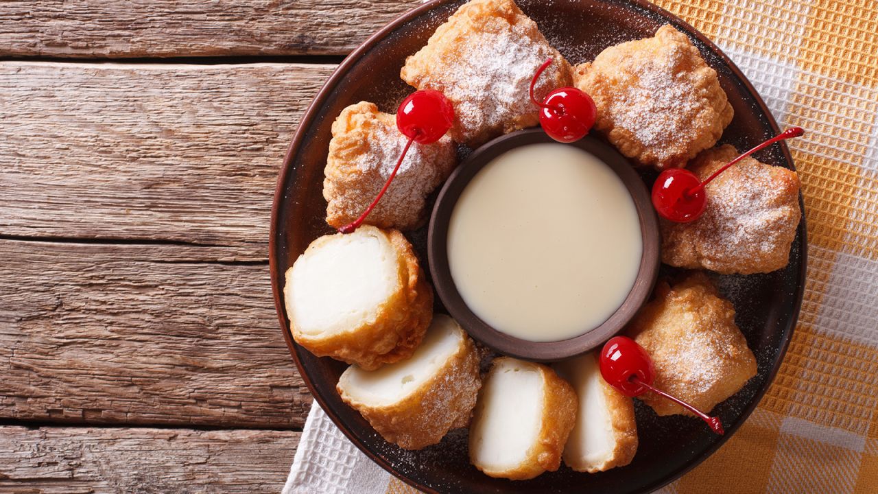 Leche frita is served with with cherries.
