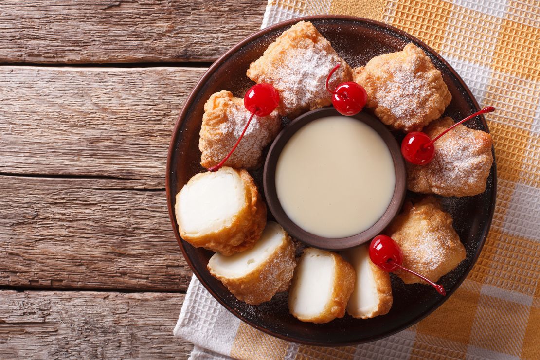 Leche frita is served with with cherries.