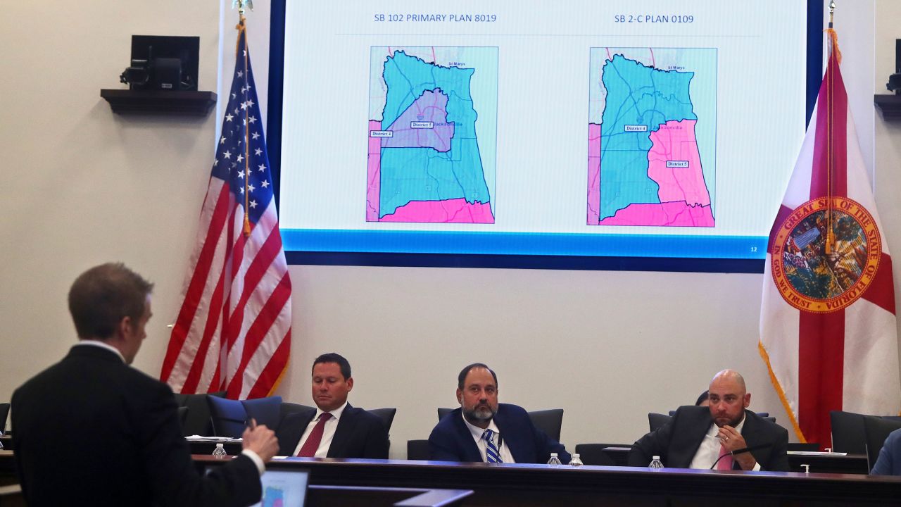 At left, J. Alex Kelly, deputy chief of staff to Florida Gov. Ron DeSantis, answers questions about the new congressional district lines his office developed during a state legislative meeting at the Capitol in Tallahassee on April 19, 2022.
