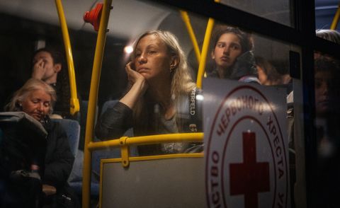 Ukrainian people evacuated from Mariupol arrive on buses at a registration and processing area for internally displaced people in Zaporizhzhia, Ukraine, on May 8.