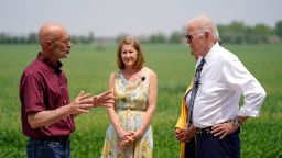 President Joe Biden listens as O'Connor Farms owner Jeff O'Connor, left, speaks and Gina O'Connor, owner of O'Connor Farms, center, looks on at the farm Wednesday, May 11, 2022, in Kankakee, Ill. (AP Photo/Andrew Harnik)