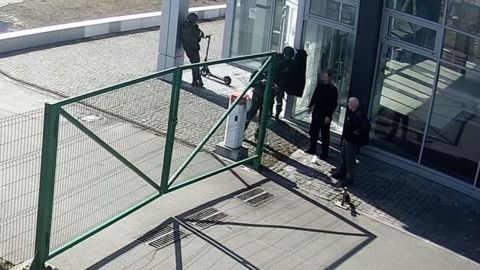 Two Ukrainian civilians talk to Russian soldiers, minutes before they are shot from behind and killed.
