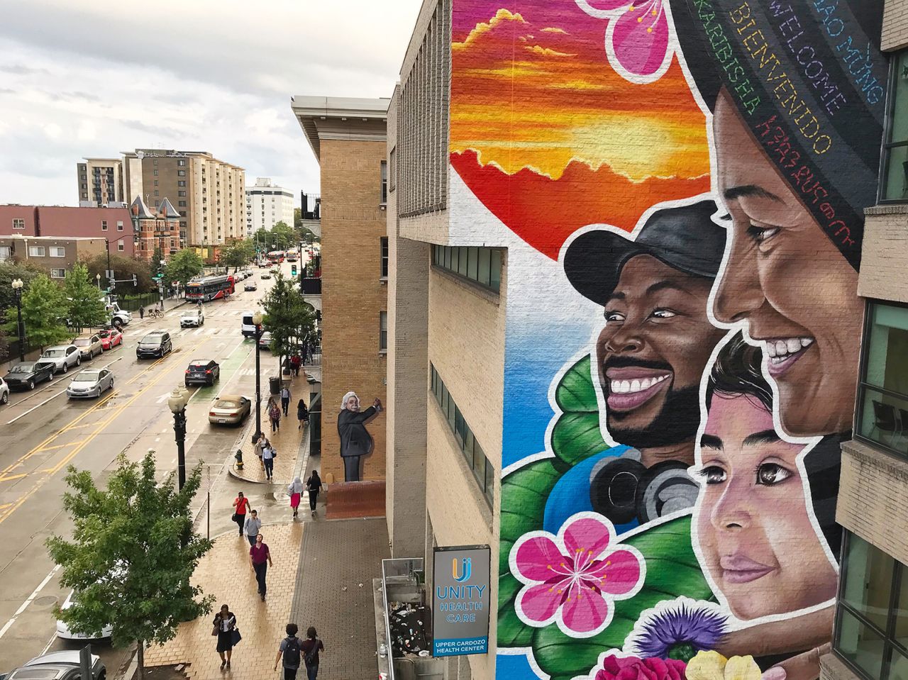 "You Are Welcome" (2018), outside Unity Health Care in Columbia Heights, a mural reflecting the multicultural patients of the clinic and a message to them.