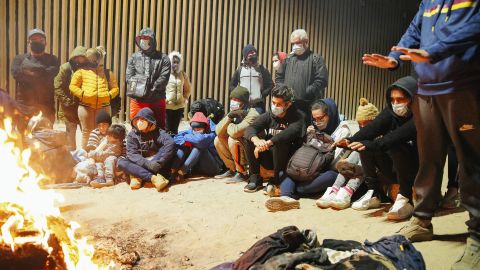 Cubans that have just crossed the US-Mexico border huddle near a fire in Yuma, Arizona in February.