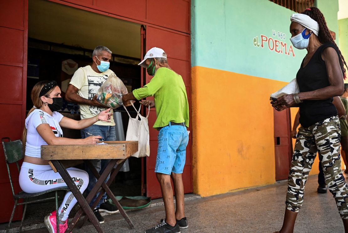 Cubans collect donated food at a supermarket in Havana in August 2021. 