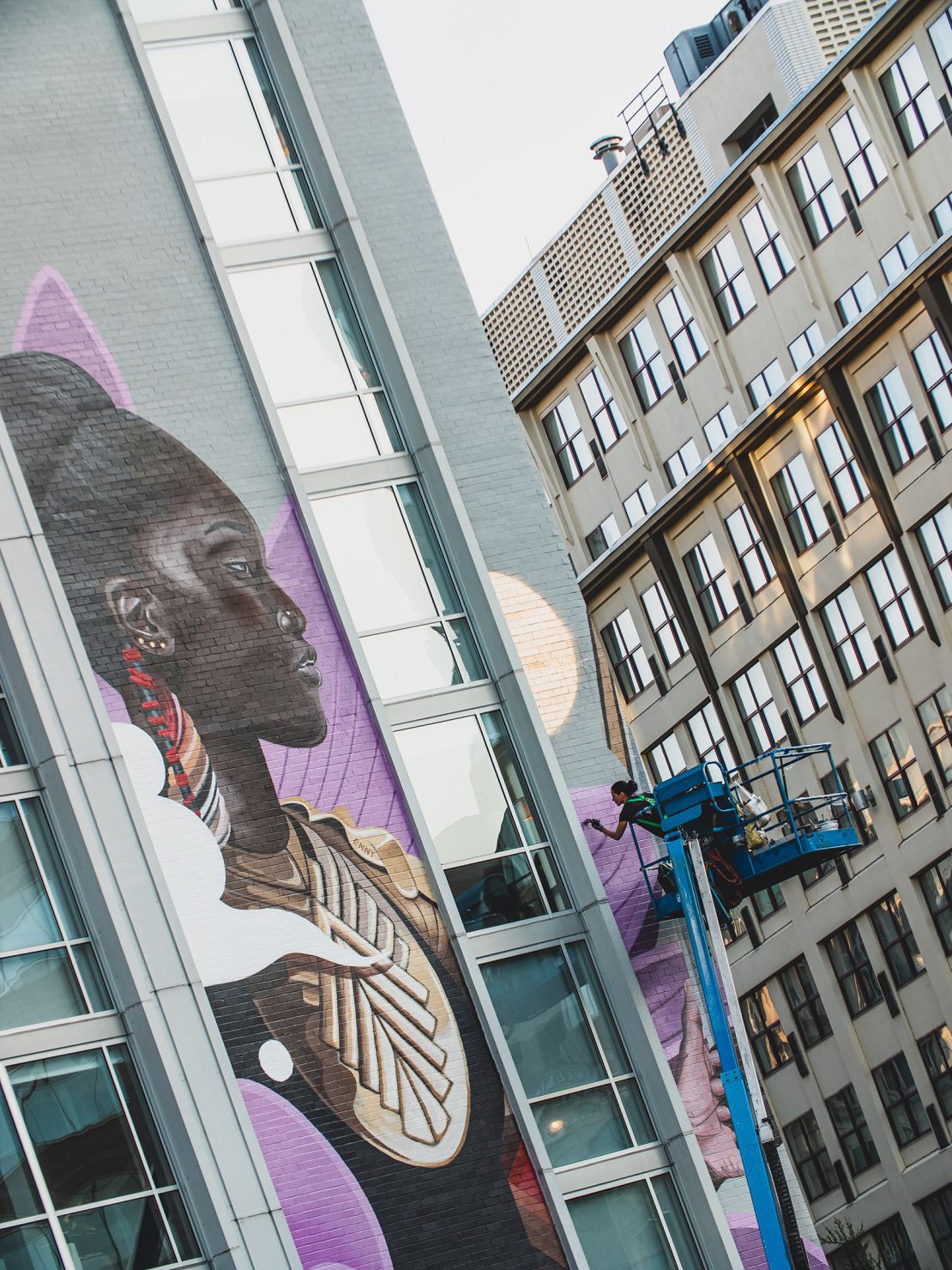 Work on "Guardians of the Four Directions" took place at the very beginning of the coronavirus outbreak and required the artist to be lifted as high as 120 feet from street level.