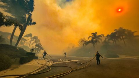 Firefighters battling the Coastal Fire in Laguna Niguel on Wednesday.