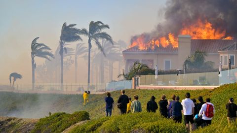 A home burns on Coronado Pointe during the Coastal Fire in Laguna Niguel on Wednesday.