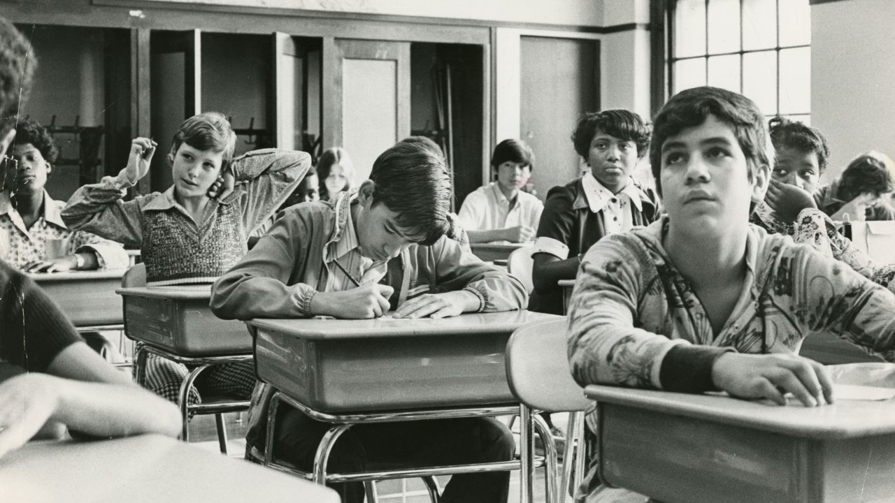 Eighth-grade students sit in an integrated classroom at Mary E. Curley School in Boston on September 12, 1974, the first day of school under the new busing system put in place to desegregate schools.