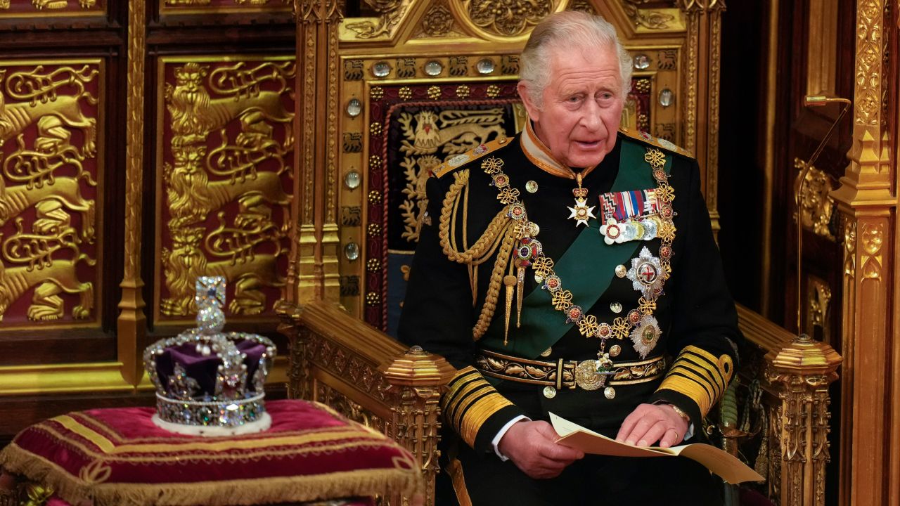 LONDON, ENGLAND - MAY 10: Prince Charles, Prince of Wales reads the Queen's speech next to her Imperial State Crown in the House of Lords Chamber, during the State Opening of Parliament in the House of Lords at the Palace of Westminster on May 10, 2022 in London, England. The State Opening of Parliament formally marks the beginning of the new session of Parliament. It includes Queen's Speech, prepared for her to read from the throne, by her government outlining its plans for new laws being brought forward in the coming parliamentary year. This year the speech will be read by the Prince of Wales as HM The Queen will miss the event due to ongoing mobility issues. (Photo by Alastair Grant - WPA Pool/Getty Images)