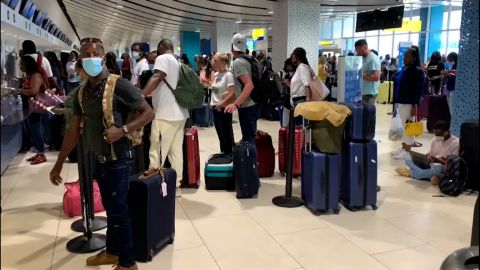 Passengers are shown stranded in Montego Bay, Jamaica, on May 12, 2022.