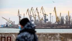 A serviceman walks in the border base in front of Ukraine's Black Sea port of Mariupol on February 11, 2022. Russia has sent six additional warships into the region for a week of naval drills involving dozens of big navy ships starting this weekend. 