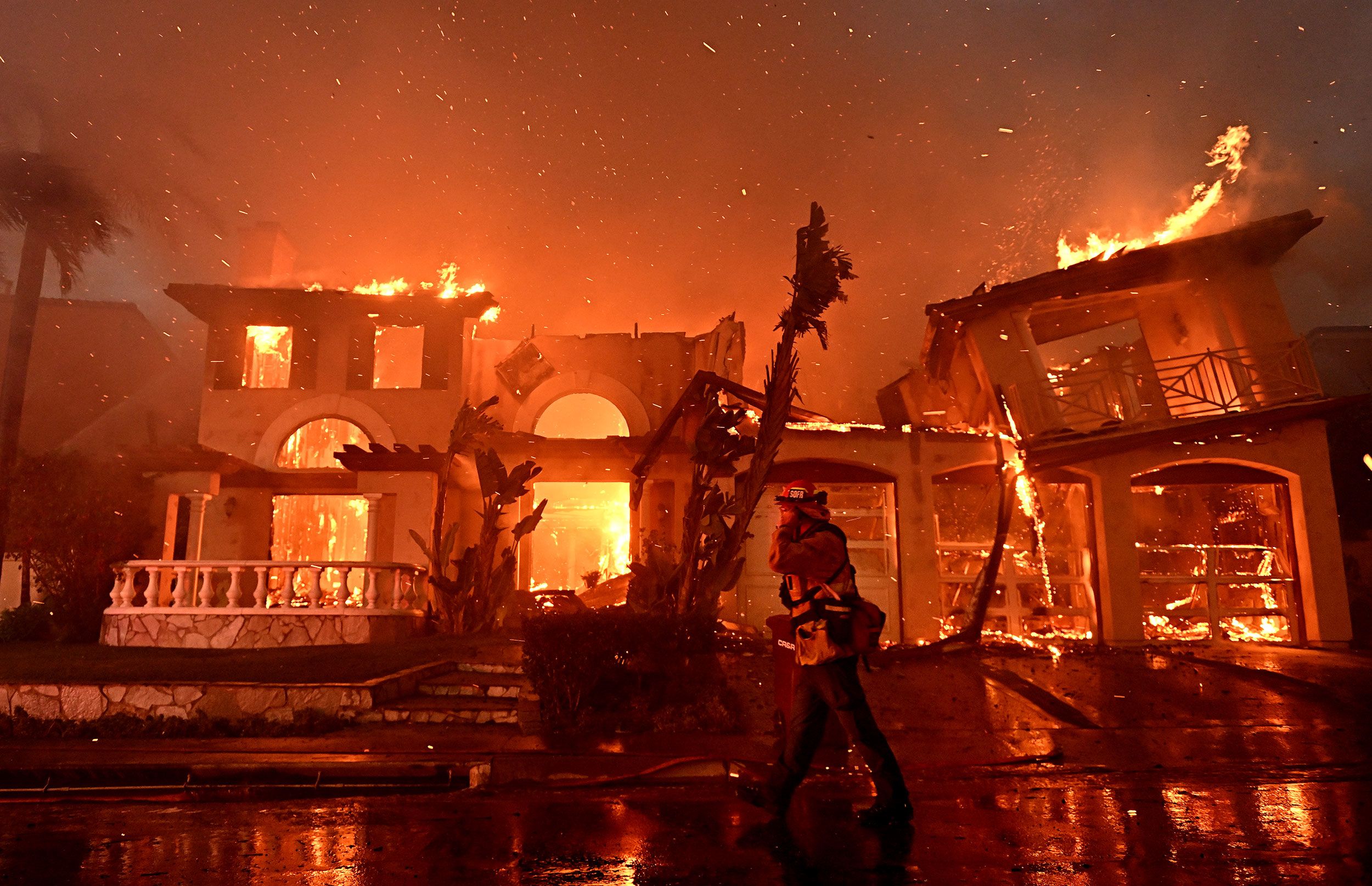 Firefighters battle a brush fire in Laguna Niguel, California, on Wednesday, May 11.