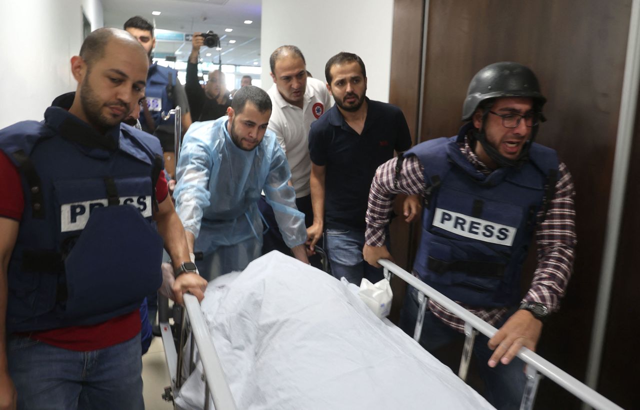 Journalists escort the body of Al Jazeera journalist Shireen Abu Akleh at a hospital in Jenin, West Bank, on Wednesday, May 11. The Palestinian-American <a href="https://www.cnn.com/2022/05/12/business/abu-akleh-memorial-ramallah-intl/index.html" target="_blank">was shot dead </a>while reporting on Israeli military raids in Jenin. The circumstances surrounding her death are unclear. Al Jazeera has accused Israeli security forces of deliberately targeting and killing Abu Akleh, 51 — one of the Arab world's most prominent journalists. Israel initially suggested it believed Palestinian militants had likely fired the fatal shot but has since said it does not know who was responsible.