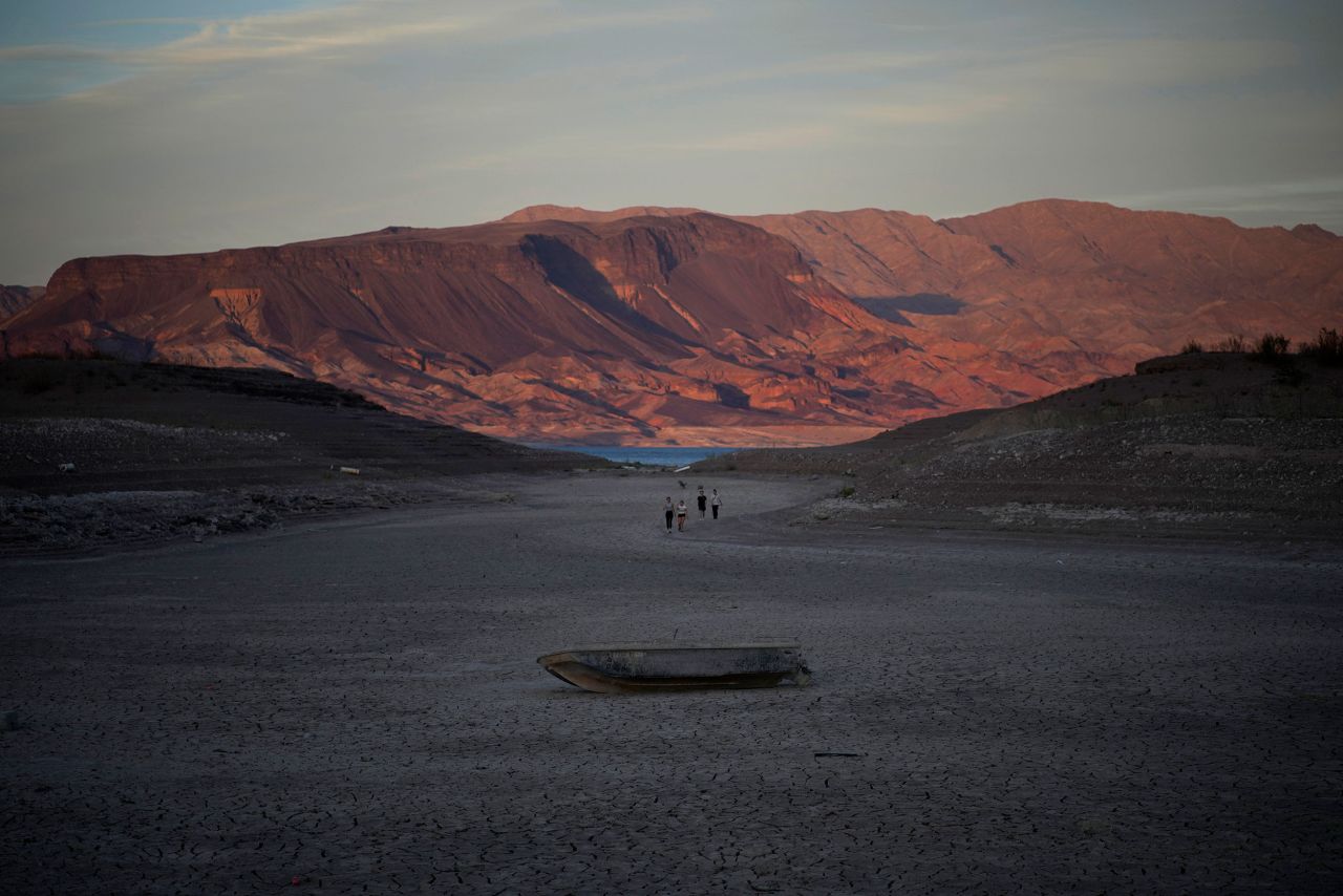 A formerly sunken boat sits on cracked earth, hundreds of feet from what is now the shoreline of Lake Mead near Boulder City, Nevada, on Monday, May 9. Lake Mead is experiencing a plunge in water levels due to an ongoing megadrought, and a <a href="https://www.cnn.com/2022/05/10/us/lake-mead-human-remains-second-investigation/index.html" target="_blank">second set of human remains were found there</a> on Saturday.