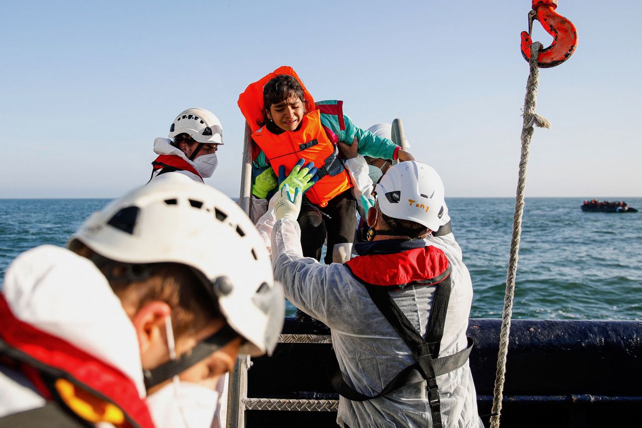A girl cries as migrants are rescued off the coast of Boulogne-sur-Mer, France, on Monday, May 9. The migrants' boat broke down in French waters as they were trying to cross the Channel to Great Britain.
