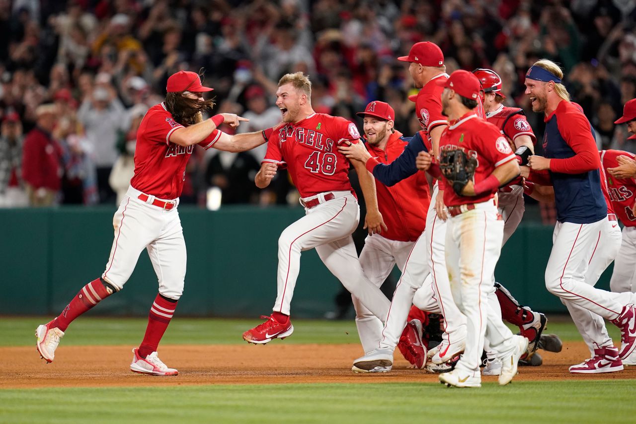Los Angeles Angels pitcher Reid Detmers is mobbed by his teammates after throwing a no-hitter against Tampa Bay on Tuesday, May 10.