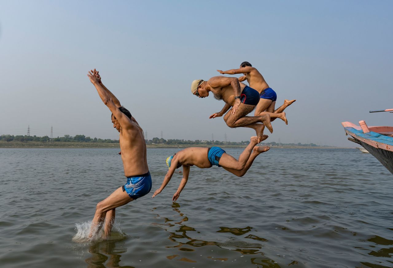 People jump into the Yamuna River to cool off on a hot summer day in Prayagraj, India, on Wednesday, May 11. Temperatures in parts of India and Pakistan<a href="https://www.cnn.com/2022/05/02/asia/india-pakistan-heatwave-climate-intl-hnk/index.html" target="_blank"> reached record levels this week.</a>
